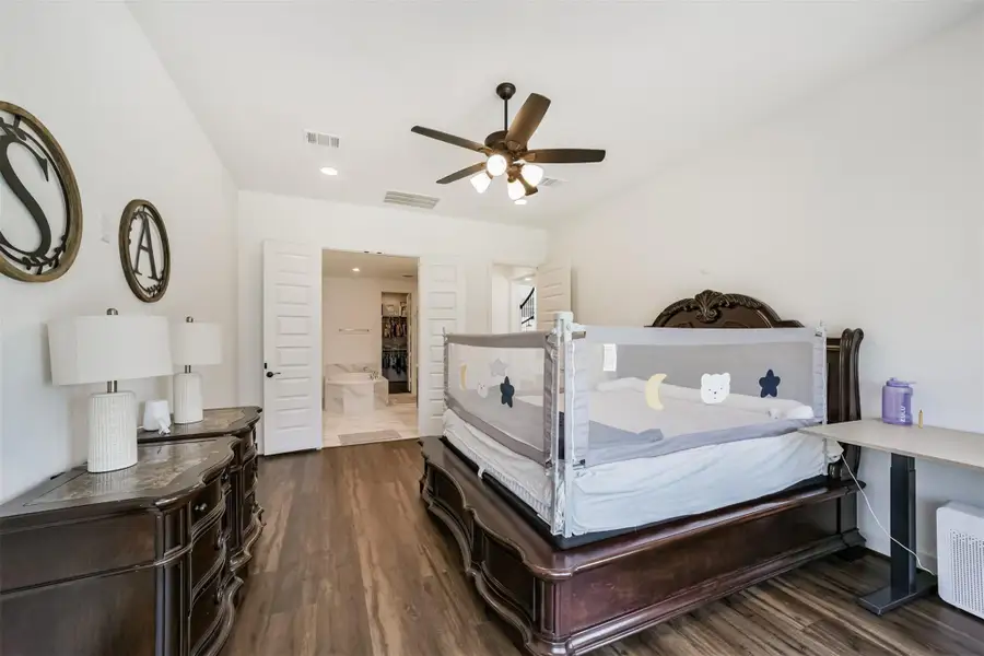 Recessed lighting and a French door lead to the en-suite. Recessed lighting and a French door lead to the en-suite.