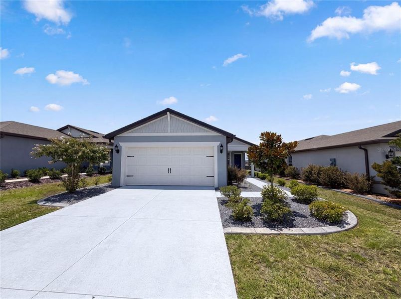 Front exterior of a new home in Del Webb Stone Creek, Ocala, FL, highlighting curb appeal (Image 18).