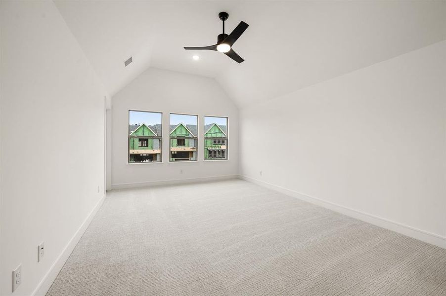 This wonderful light filled owner's suite features dramatic ceilings paired with plush carpeting to create a peaceful and relaxing space. This wonderful light filled owner's suite features dramatic ceilings paired with plush carpeting to create a peaceful and relaxing space.