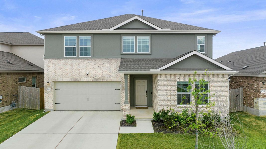 A welcoming facade features a combination of brick and stucco, offering inviting curb appeal. A welcoming facade features a combination of brick and stucco, offering inviting curb appeal.