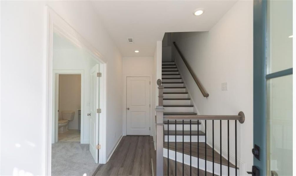 Entry from the terrace level.  A bedroom or home office is conveniently located on the terrace level.   Picture NOT of actual home, but a representation of a previously built TPG property.