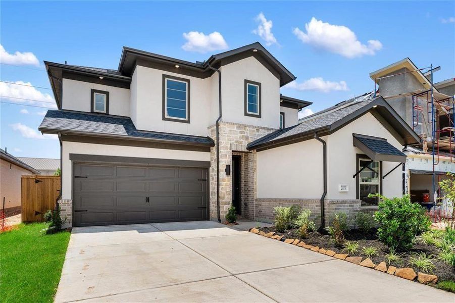 Front exterior of a new home in Cross Creek Ranch 45' 70', Fulshear, TX, highlighting curb appeal (Image 24).