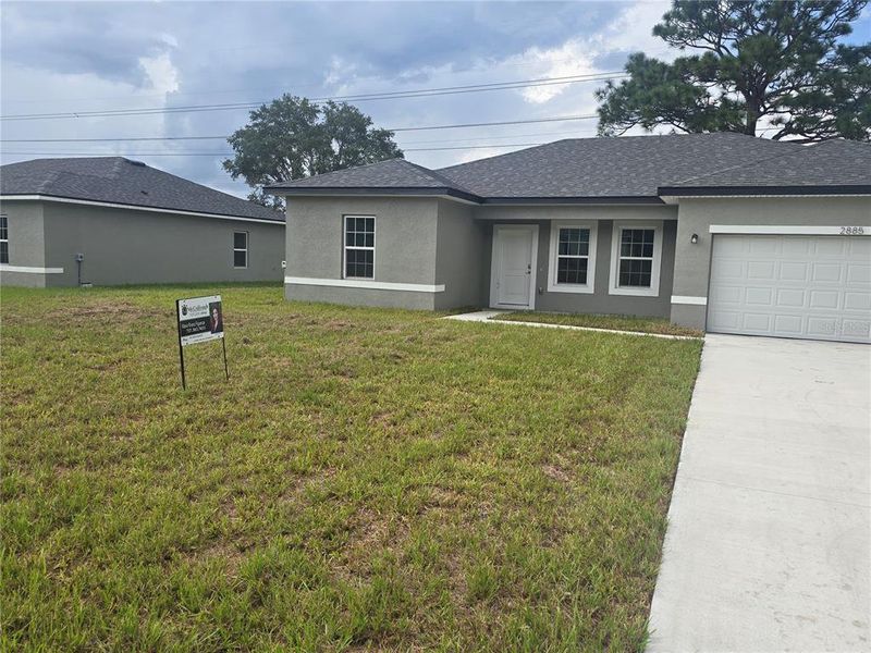 Front exterior of a new home in , Citrus Springs, FL, highlighting curb appeal (Image 14).