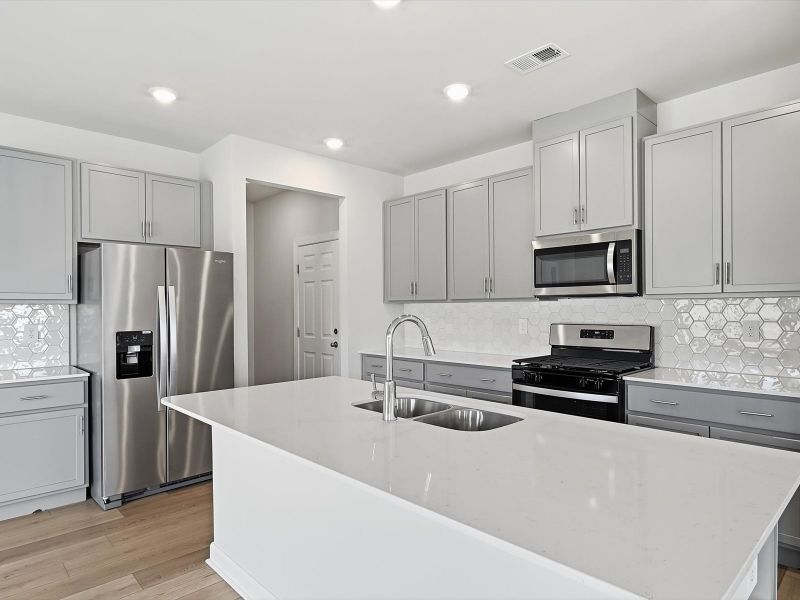 Furnished interior view inside a new home in The Farm at Wells Creek - Signature Collection, Gray Court (Image 4). Furnished interior view inside a new home in The Farm at Wells Creek - Signature Collection, Gray Court (Image 4).