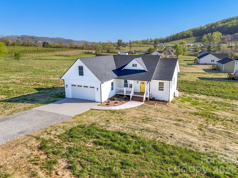 Front exterior of a new home in , Hendersonville, NC, highlighting curb appeal (Image 2). Front exterior of a new home in , Hendersonville, NC, highlighting curb appeal (Image 2).