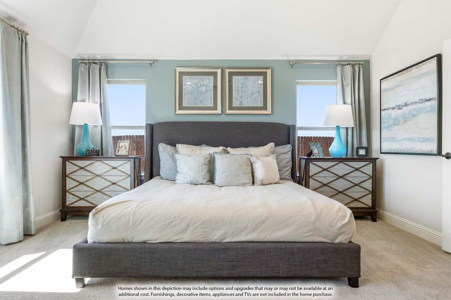 Bedroom with gray upholstered bed, teal accent wall, two windows, and matching nightstands with lamps Bedroom with gray upholstered bed, teal accent wall, two windows, and matching nightstands with lamps