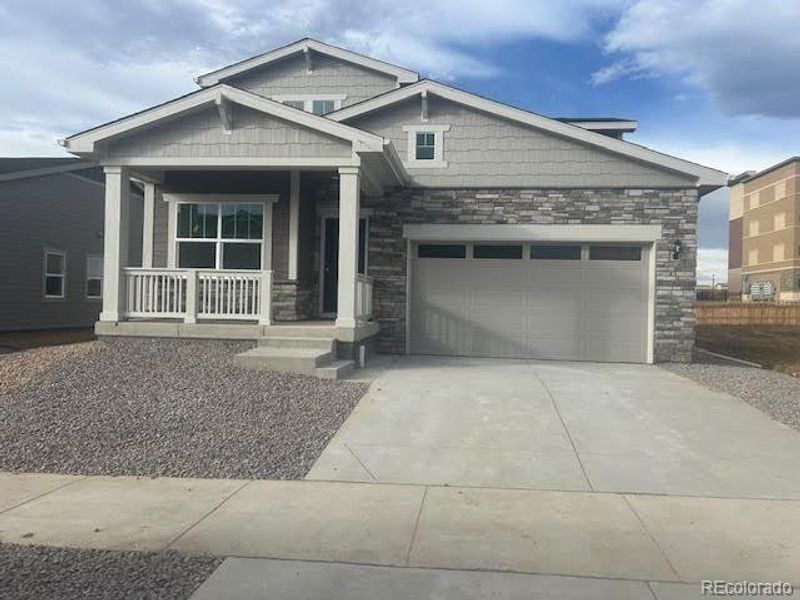Front exterior of a new home in Ledge Rock: The Petal Collection, Johnstown, CO, highlighting curb appeal (Image 1). Front exterior of a new home in Ledge Rock: The Petal Collection, Johnstown, CO, highlighting curb appeal (Image 1).
