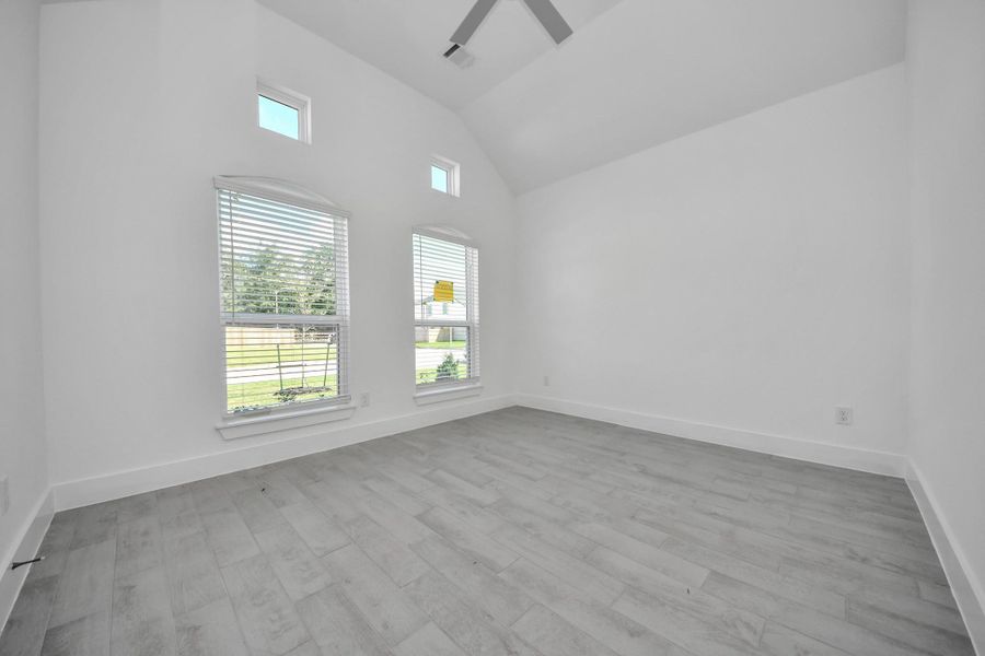 Step into the inviting home office, where elegant tile flooring adds a touch of freshness and comfort to the workspace. Natural light pours through the window, creating an inspiring environment for productivity and focus.