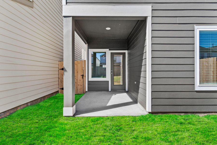 Exterior details and patio area of a home in Grand West, Houston (Image 18).
