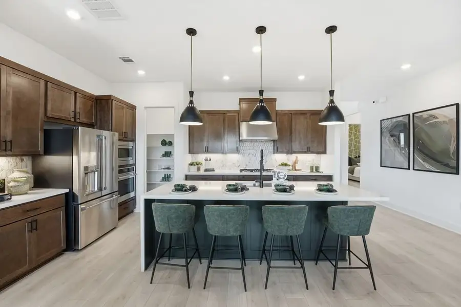 Furnished interior view inside a new home in Travisso, Leander (Image 3).