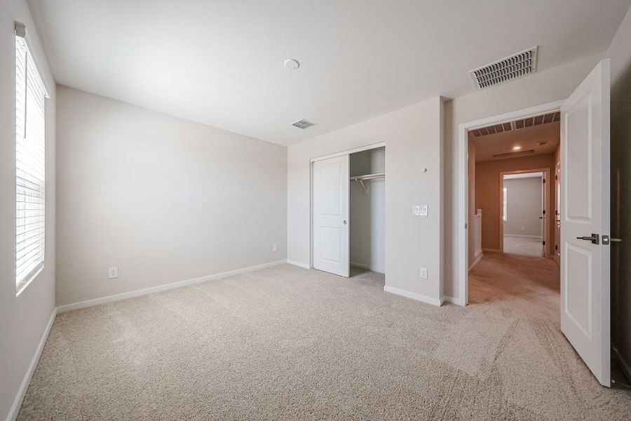 A hallway with white walls.