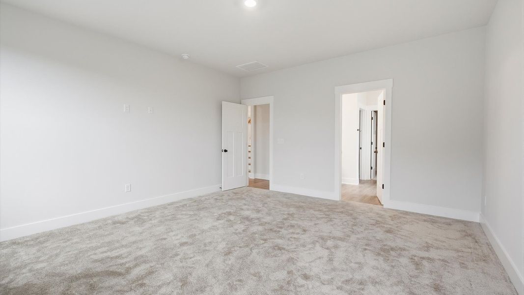 Spacious and serene primary suite with thoughtful design in a desirable DRB Homes community Spacious and serene primary suite with thoughtful design in a desirable DRB Homes community