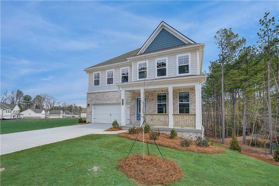 Front exterior of a new home in Hamilton Lakes, Lawrenceville, GA, highlighting curb appeal (Image 2). Front exterior of a new home in Hamilton Lakes, Lawrenceville, GA, highlighting curb appeal (Image 2).