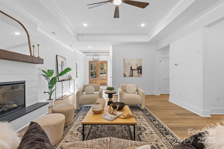 *representative photo- family room w/ tray ceiling, shiplap fireplace & cedar mantle!