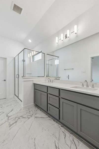 Primary Bathroom in the Claret home plan by Trophy Signature Homes – REPRESENTATIVE PHOTO