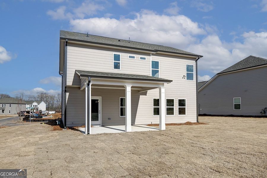 Front exterior of a new home in Enclave at Logan Point, Loganville, GA, highlighting curb appeal (Image 17).