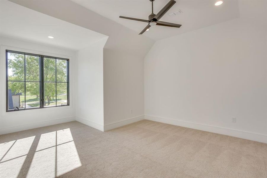 Unfurnished room featuring recessed lighting, light carpet, lofted ceiling, and ceiling fan