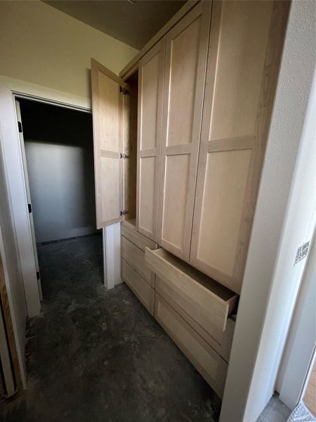 Convenient built-in storage cabinets and drawers in the primary bath provide ample space for linens, toiletries, and everyday essentials. Convenient built-in storage cabinets and drawers in the primary bath provide ample space for linens, toiletries, and everyday essentials.