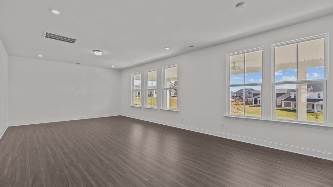 Burton Design open concept family room with large windows for abundant natural light. At Lakeside Glen by DRB Homes, York, SC Burton Design open concept family room with large windows for abundant natural light. At Lakeside Glen by DRB Homes, York, SC