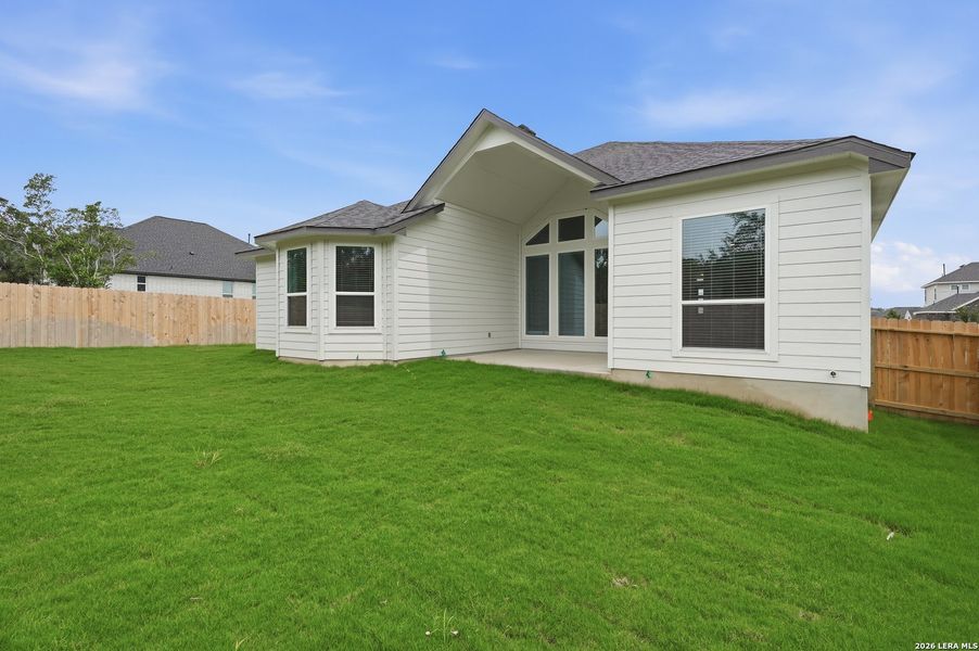 Exterior details and patio area of a home in The Reserve at Potranco Oaks, Castroville (Image 25).