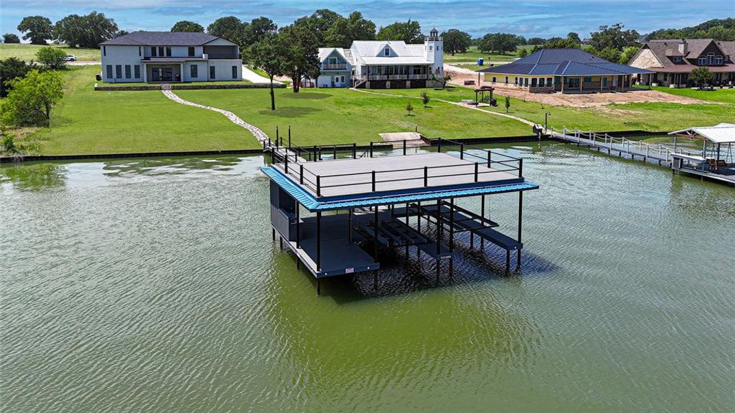 Dock with boat lift and a water view