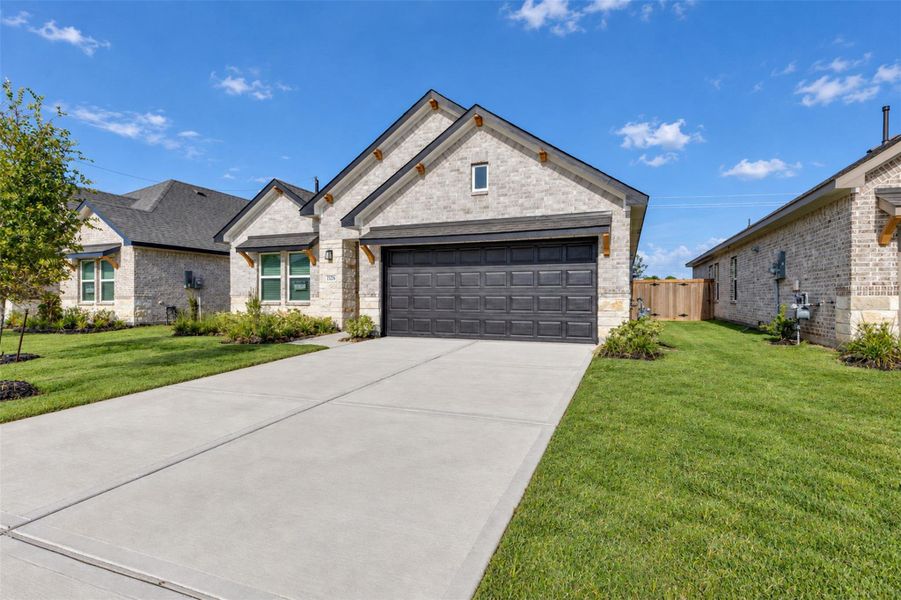 Front exterior of a new home in , Angleton, TX, highlighting curb appeal (Image 26).