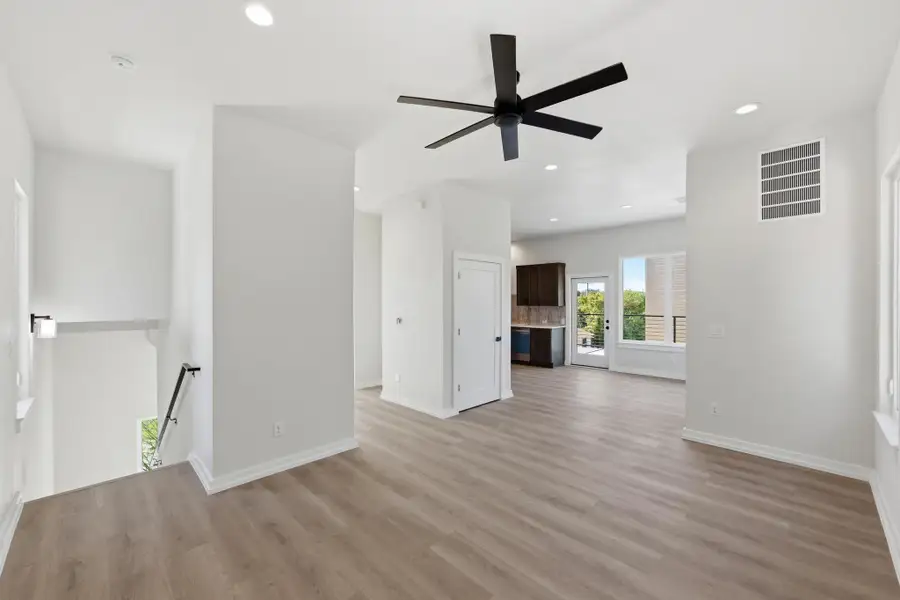 Unfurnished living room with light wood-style floors, recessed lighting, and ceiling fan