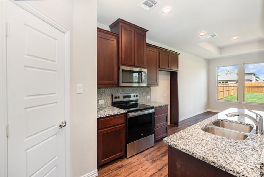 Furnished interior view inside a new home in Courts Of Bonnie Brae, Denton (Image 8).