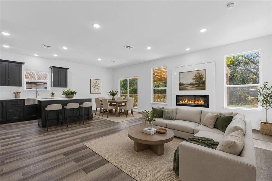 Virtually Staged: An open-concept main floor flows seamlessly from the kitchen and dining area to the living space. Virtually Staged: An open-concept main floor flows seamlessly from the kitchen and dining area to the living space.