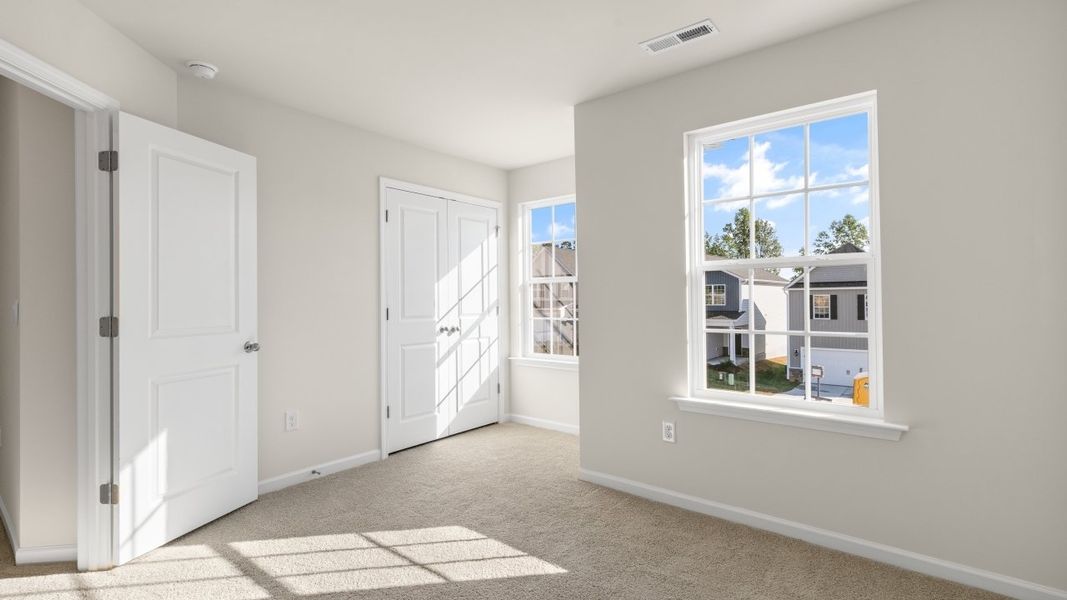 Spacious, unfurnished interior of a new home in The Grove at Matthews Landing, Fuquay Varina (Image 30).