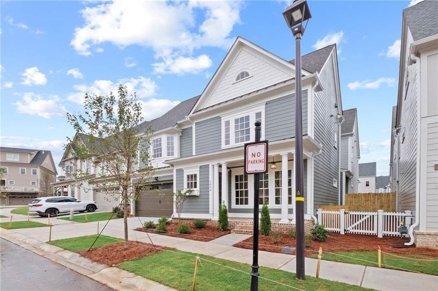 Front exterior of a new home in , Woodstock, GA, highlighting curb appeal (Image 19).