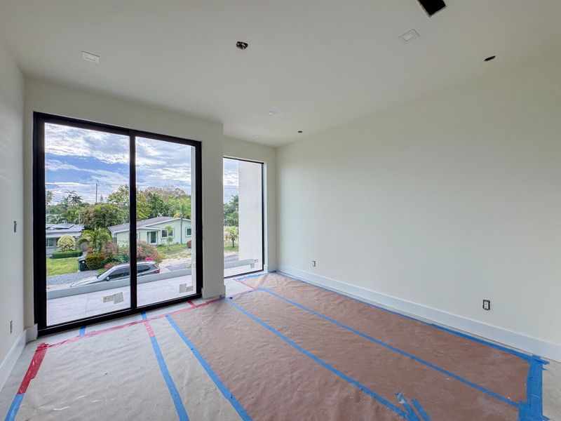 (as of April 8, 2026) the first guest bedroom on the second level features a nook perfect for a vanity or desk, along with access to a shared patio balcony