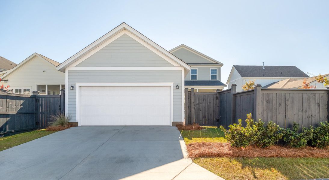 Front exterior of a new home in Midtown at Nexton, Summerville, SC, highlighting curb appeal (Image 21). Front exterior of a new home in Midtown at Nexton, Summerville, SC, highlighting curb appeal (Image 21).