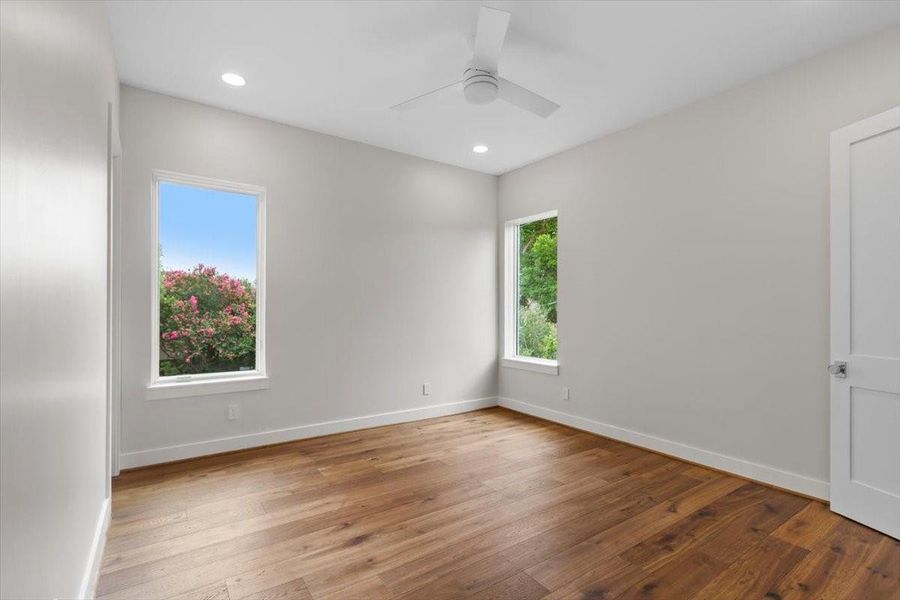 All secondary bedrooms have wood floors, can lights and a remote controlled ceiling fan