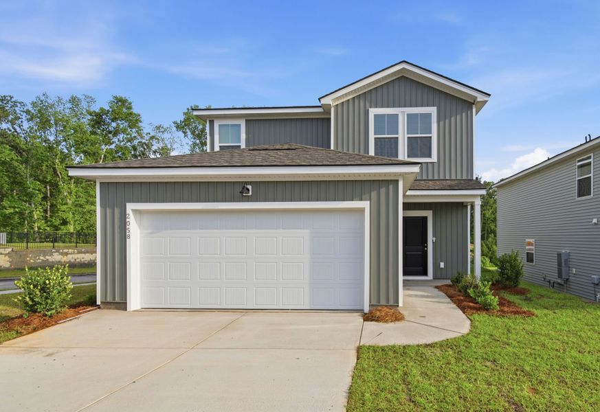 Front exterior of a new home in Grand Arbor, Blythewood, SC, highlighting curb appeal (Image 2). Front exterior of a new home in Grand Arbor, Blythewood, SC, highlighting curb appeal (Image 2).