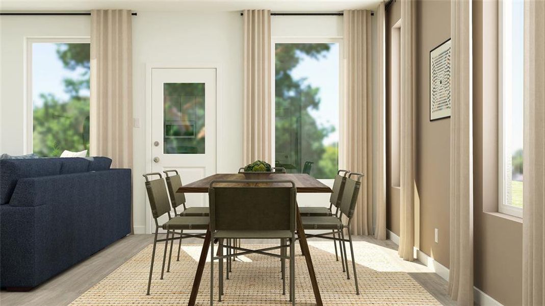 Dining room featuring plenty of natural light and light hardwood / wood-style flooring