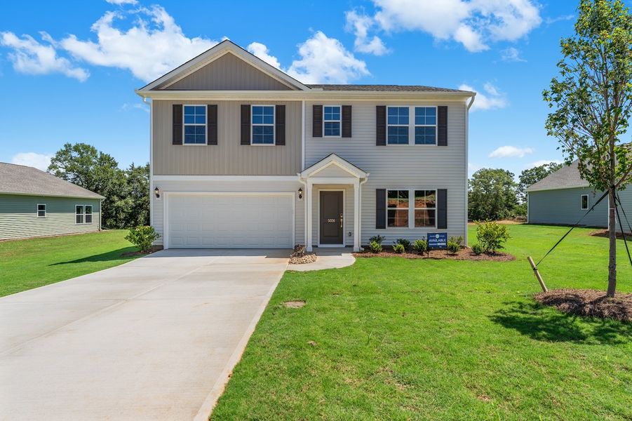 Front exterior of a new home in Burke Estates, Chesnee, SC, highlighting curb appeal (Image 1). Front exterior of a new home in Burke Estates, Chesnee, SC, highlighting curb appeal (Image 1).
