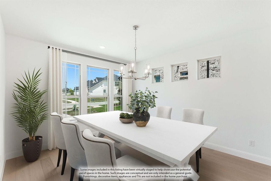 Bright dining room with white table, upholstered chairs, chandelier, and large windows overlooking a neighborhood.