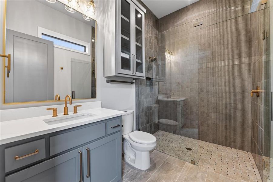 Walk-in shower with full glass enclosure and tiled walls Walk-in shower with full glass enclosure and tiled walls