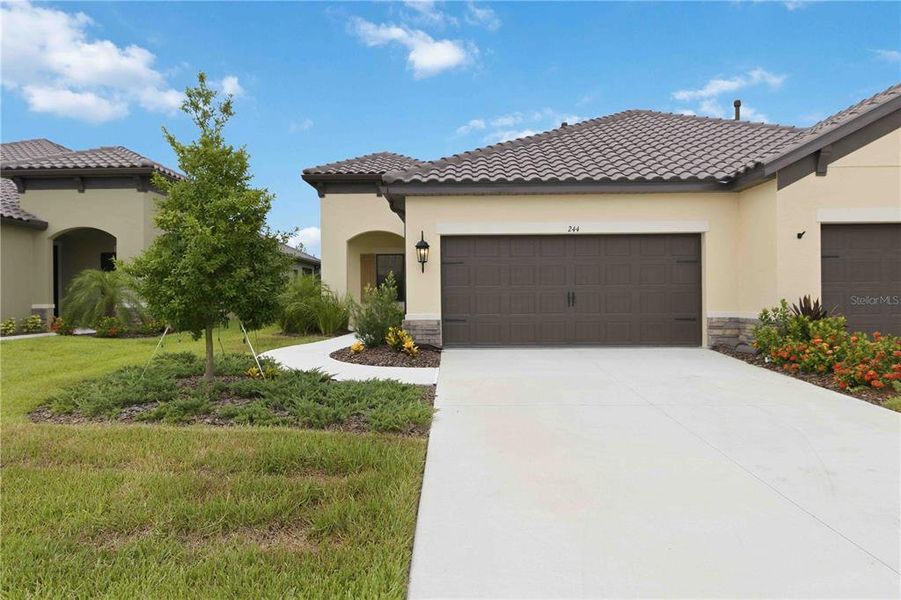 Front exterior of a new home in , Nokomis, FL, highlighting curb appeal (Image 1). Front exterior of a new home in , Nokomis, FL, highlighting curb appeal (Image 1).