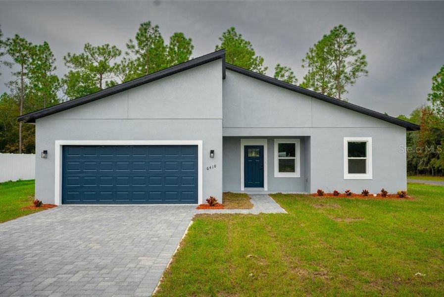 Front exterior of a new home in , Ocala, FL, highlighting curb appeal (Image 20).
