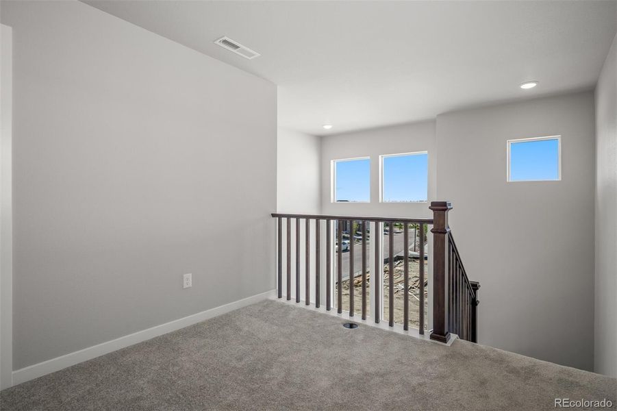 Spacious, unfurnished interior of a new home in Revel Crossing at Wolf Ranch – The Ascent Collection, Colorado Springs (Image 17).