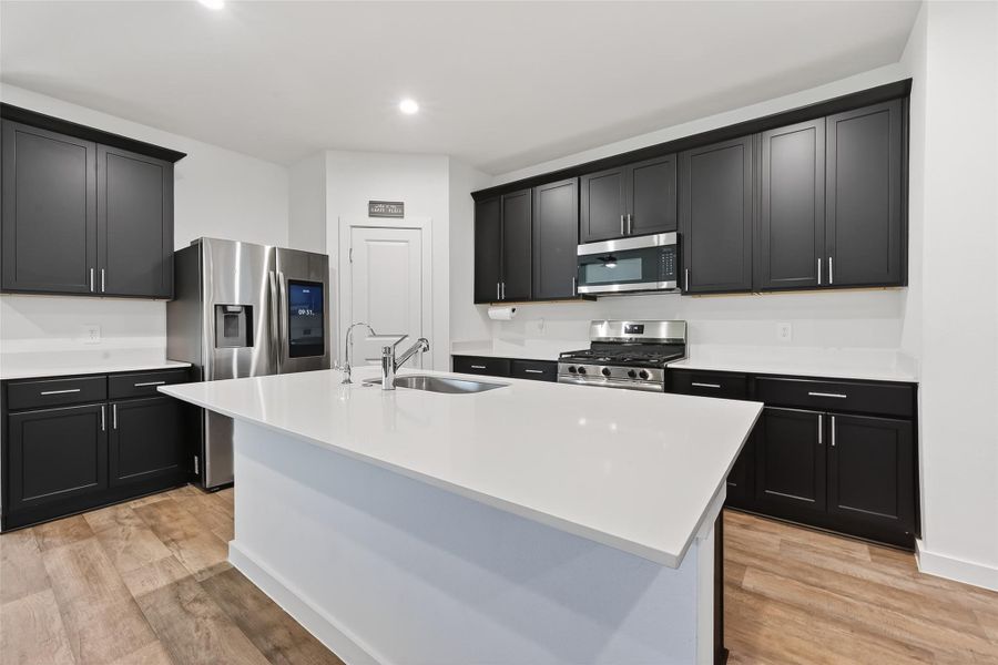 Large kitchen island offering extra seating, ideal for casual dining and gatherings