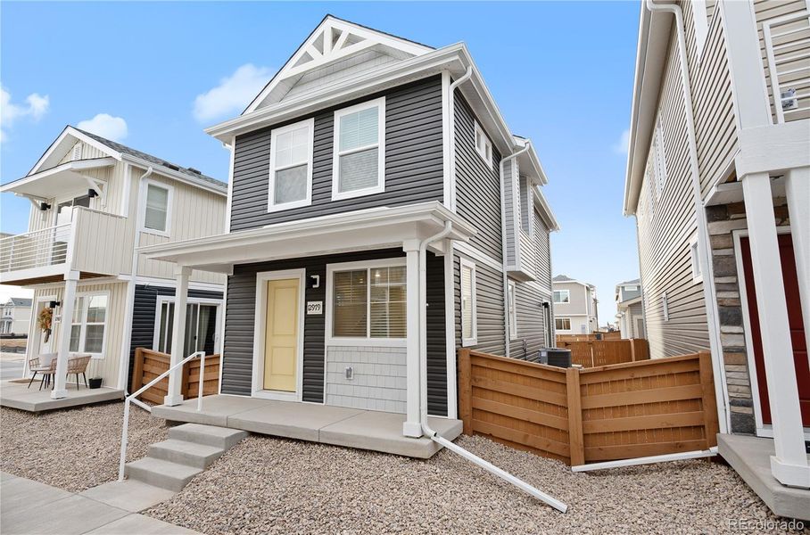 Exterior details and patio area of a home in Reunion, Commerce City (Image 17).