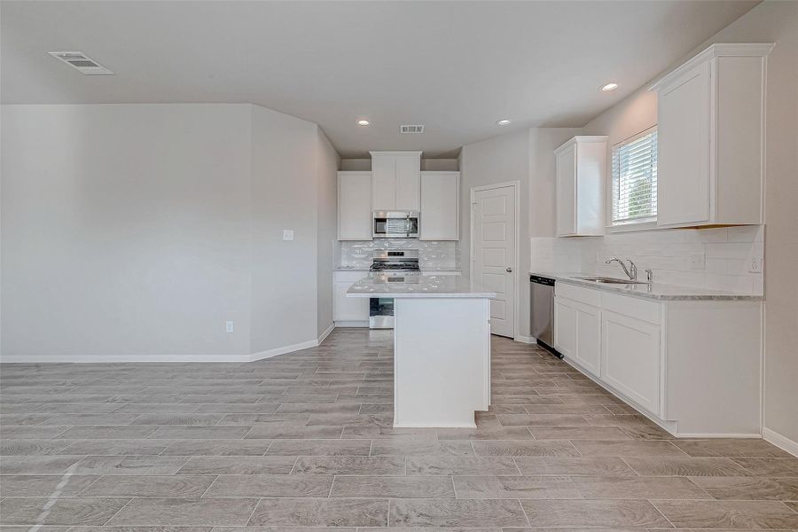 Furnished interior view inside a new home in Mill Creek Trails, Magnolia (Image 7).