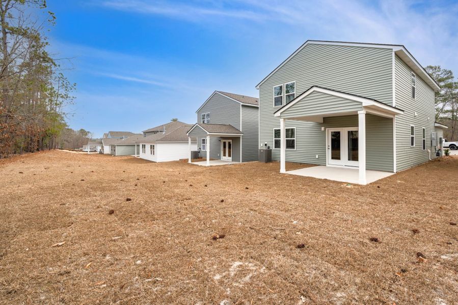 Exterior details and patio area of a home in Grand Arbor, Blythewood (Image 3).