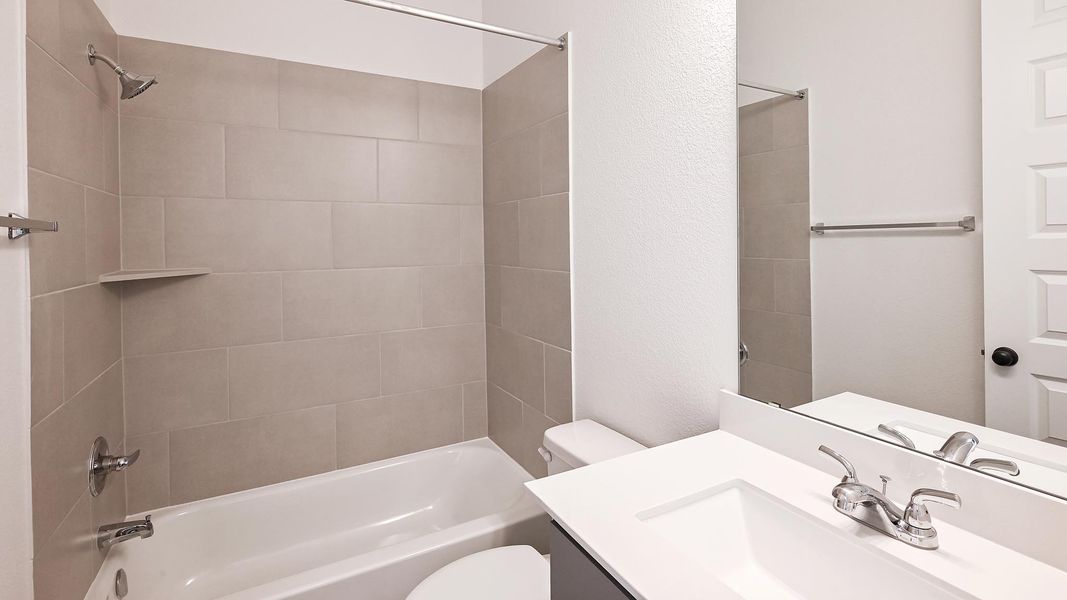 Furnished interior view inside a new home in 6 Creeks 50', Kyle (Image 11).