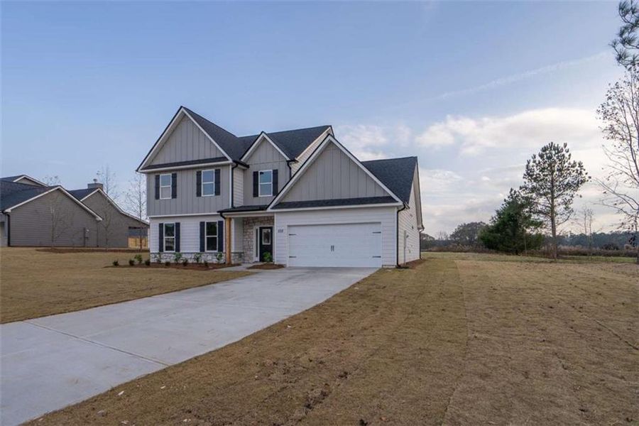 Front exterior of a new home in , Good Hope, GA, highlighting curb appeal (Image 4).