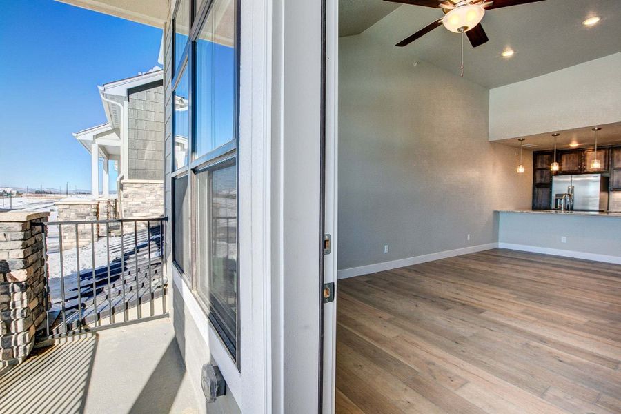 View of Living Room from Covered Terrace - Not Actual Home - Finishes May Vary