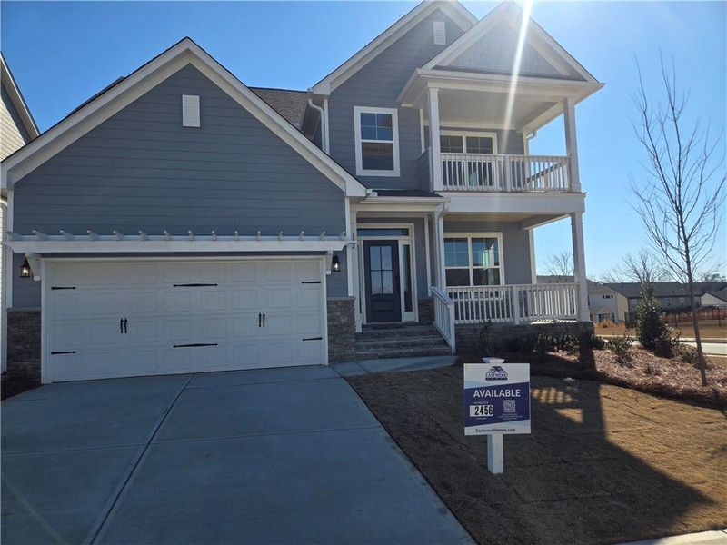 Front exterior of a new home in Twin Lakes, Hoschton, GA, highlighting curb appeal (Image 1). Front exterior of a new home in Twin Lakes, Hoschton, GA, highlighting curb appeal (Image 1).